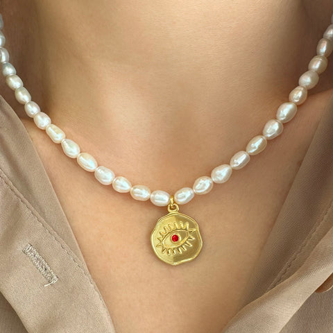 Real pearl necklace with an Evil Eye Pendant