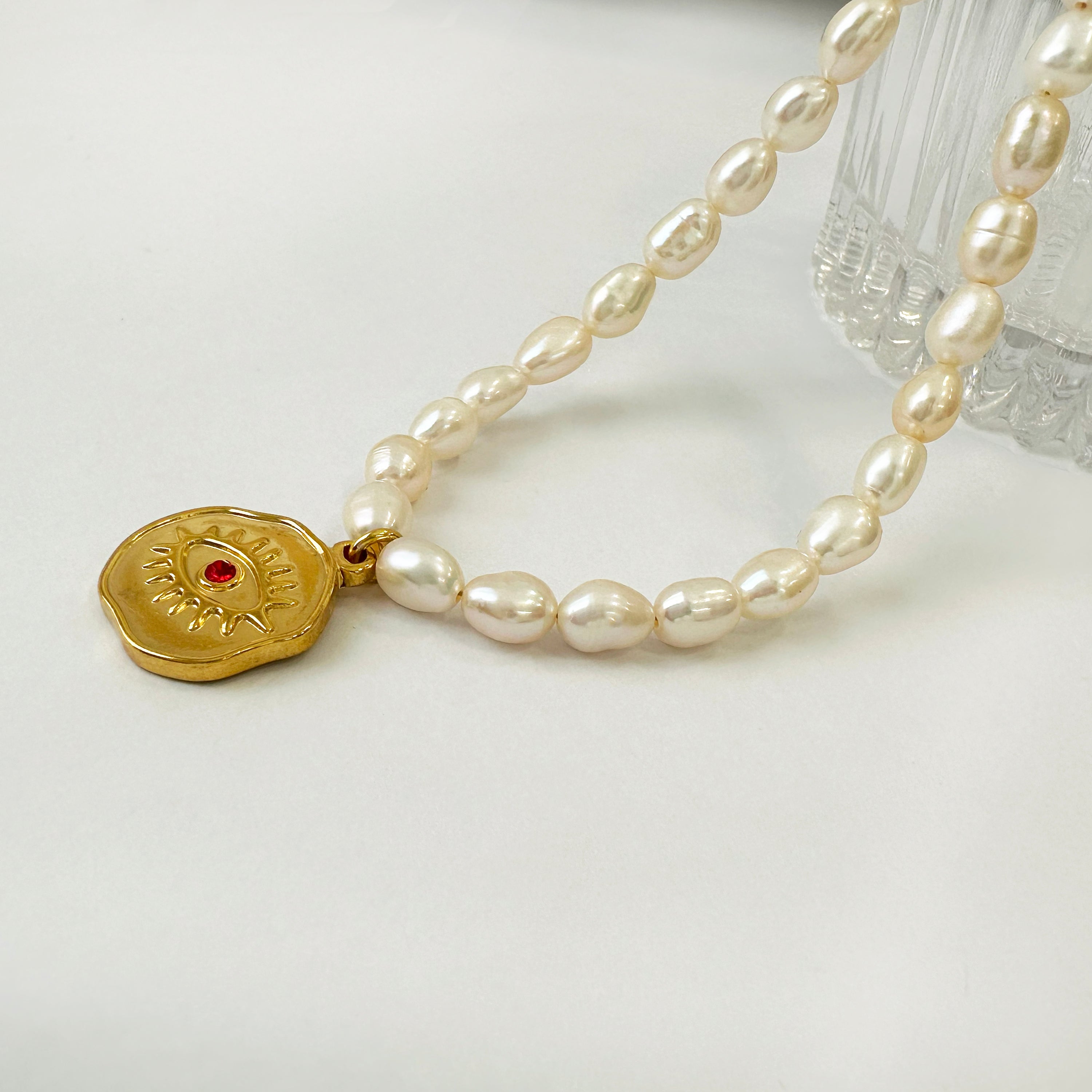 Real pearl necklace with an Evil Eye Pendant