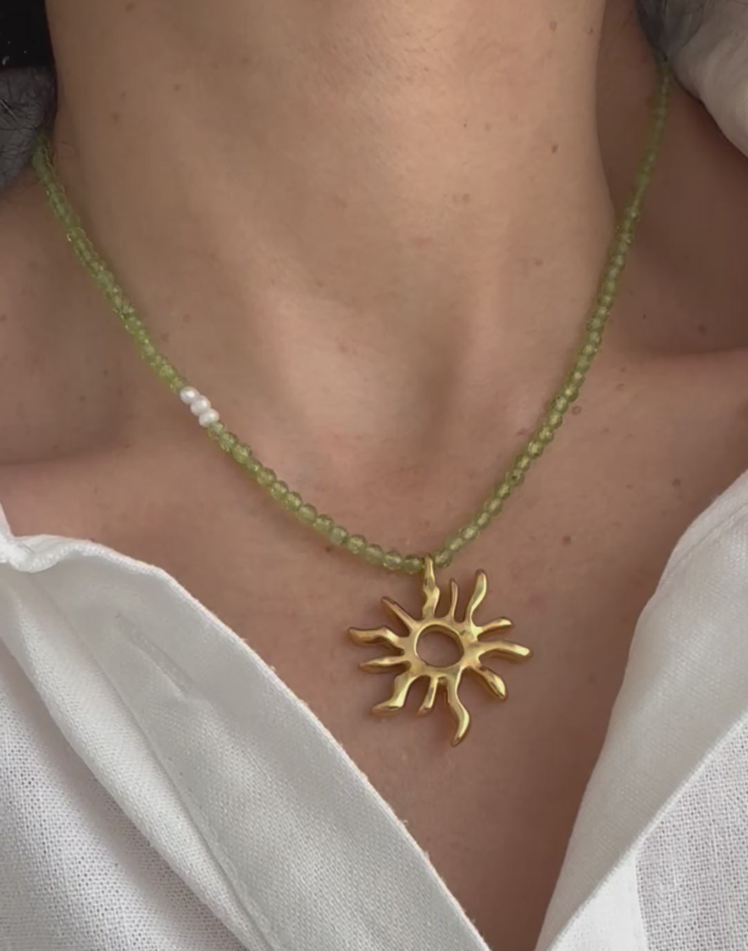 Load video: Gold sun charm choker necklace with peridot gemstone