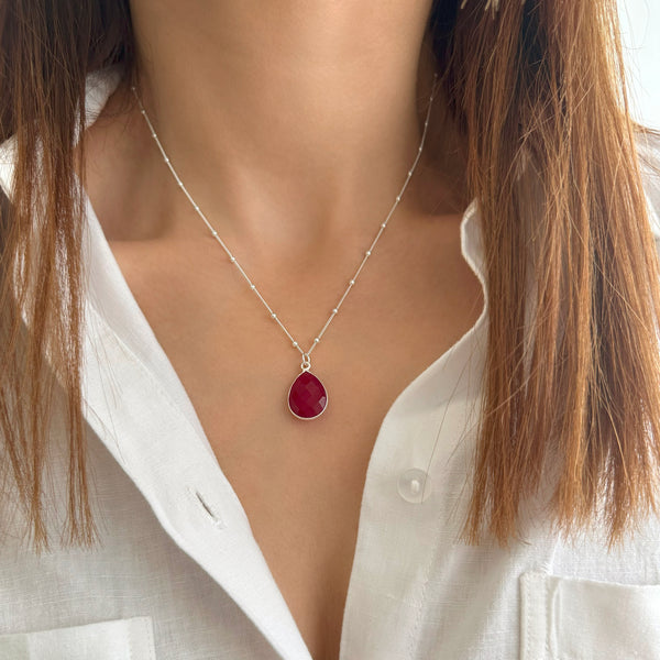 Layered necklace with a ruby pendant and paperclip chain