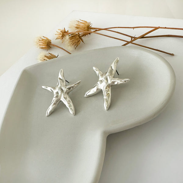 Silver starfish studs,