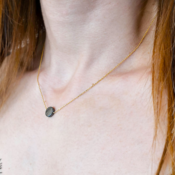 Hematite Necklace with a Hematite circle gem and sterling Silver .
