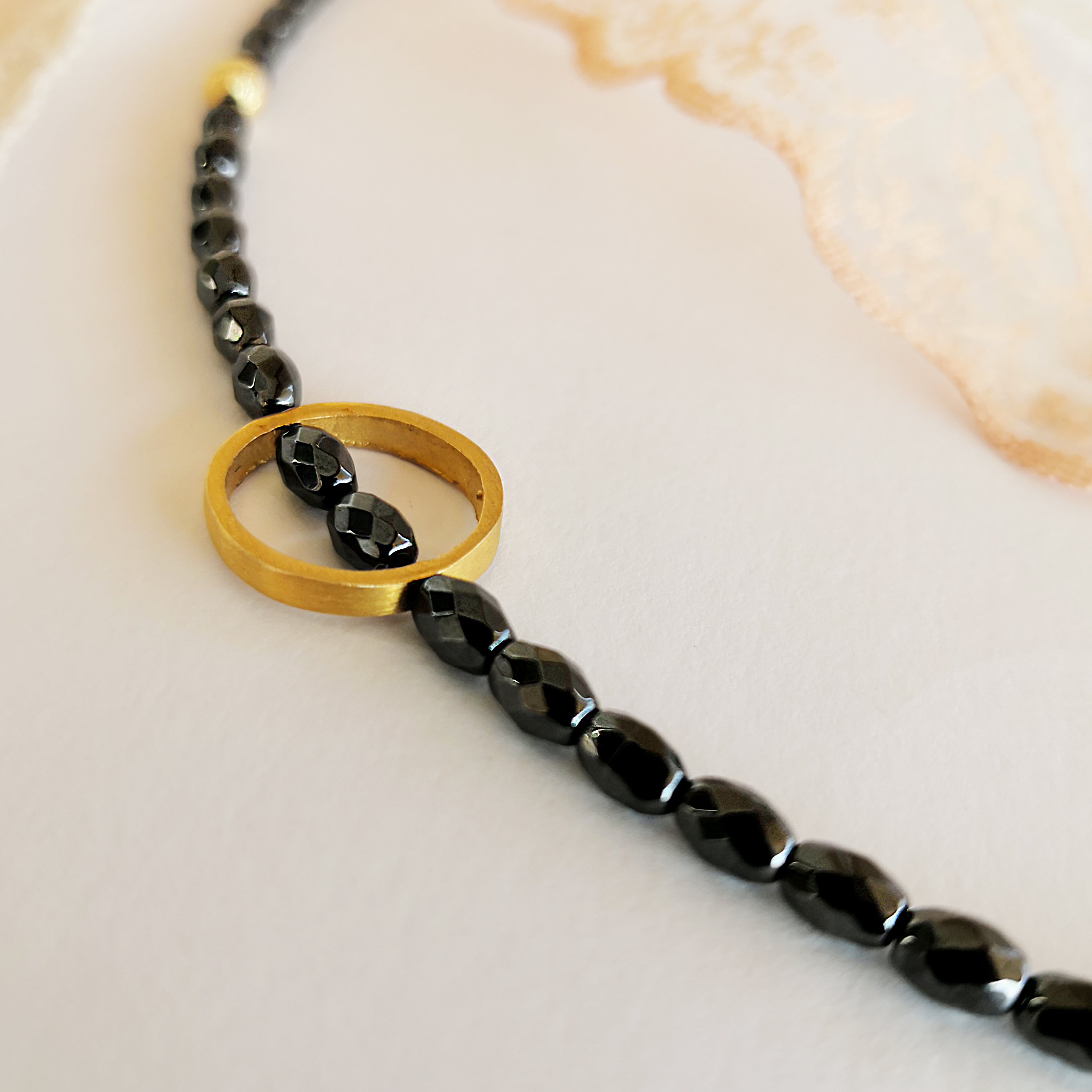 Dainty Boho Hematite Bracelet with a gold circle