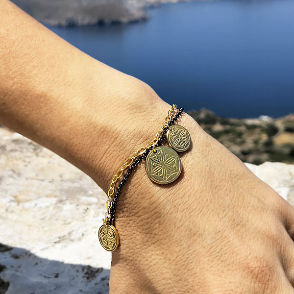 Gold Coin Bracelet with greek coins and hematite gemstone in a shell