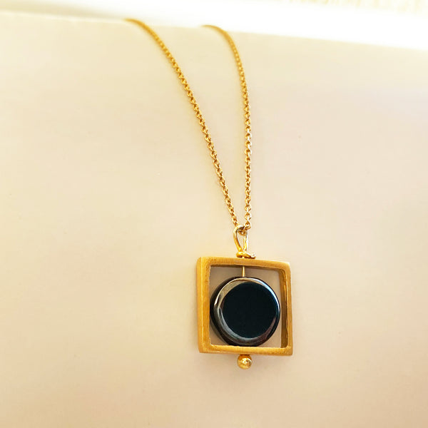 Fidget necklace with a square pendant and hematite gemstone