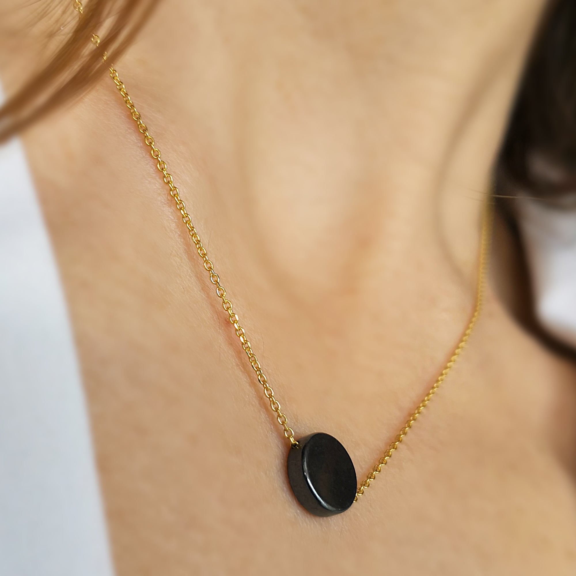 Hematite Necklace with a Hematite circle gem and sterling Silver .