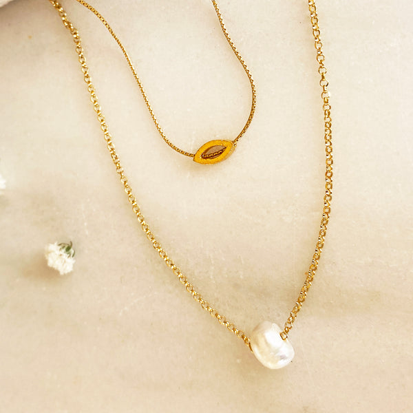 Layered Necklaces set with a tiny eye pendant and a genuine pearl.