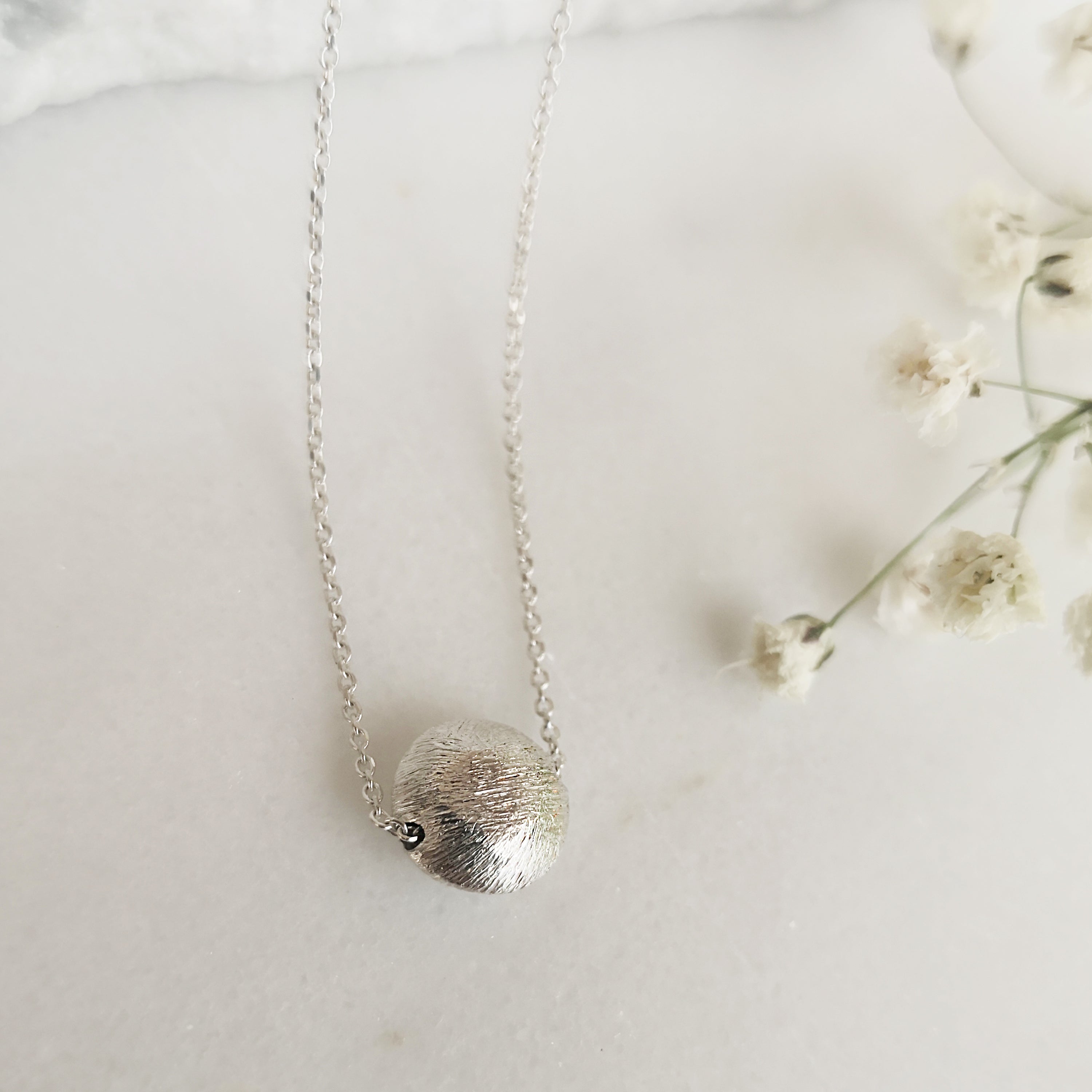 Minimalist Necklace with a shiny silver sphere pendant