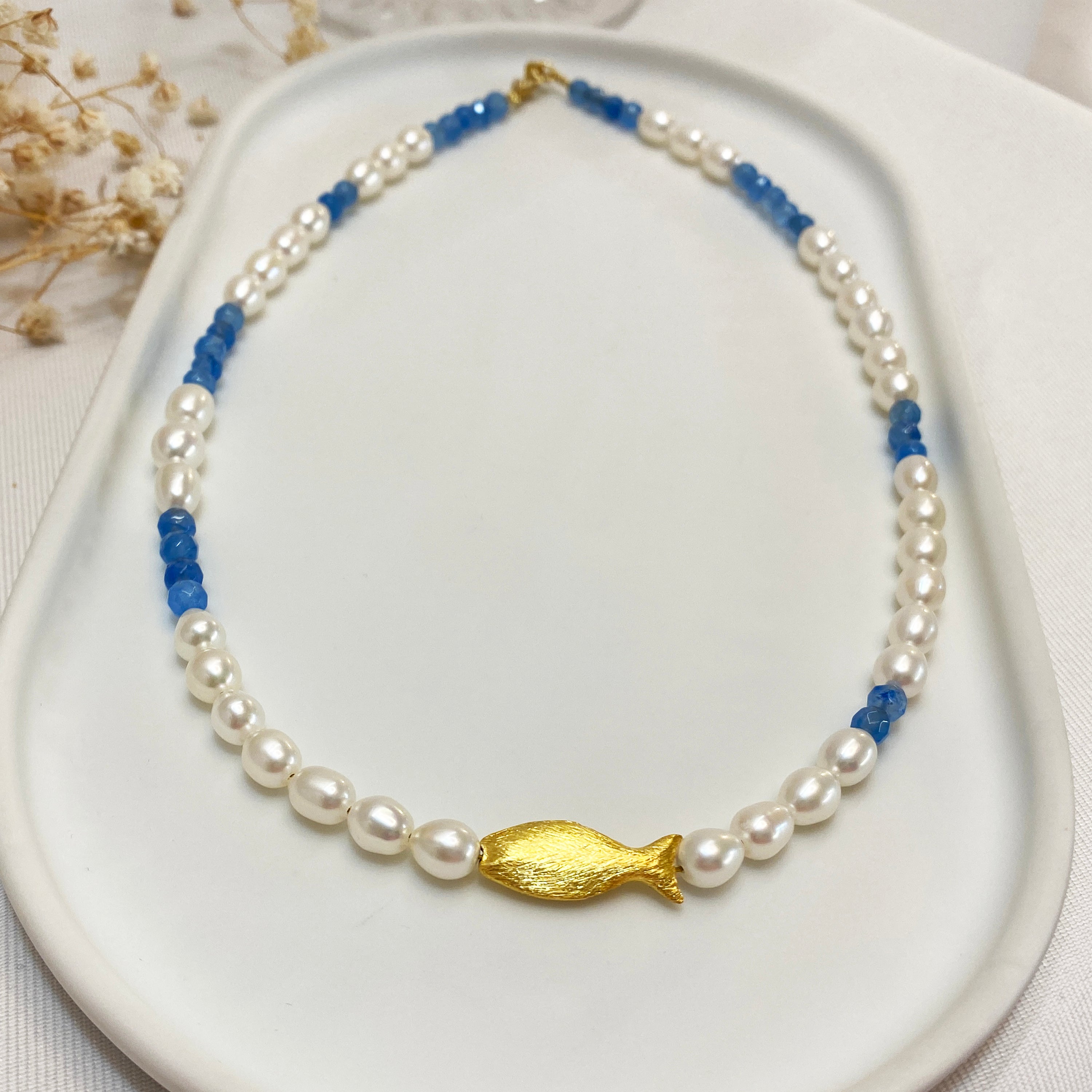 Seed Pearl Necklace with a gold fish and blue sapphire gems