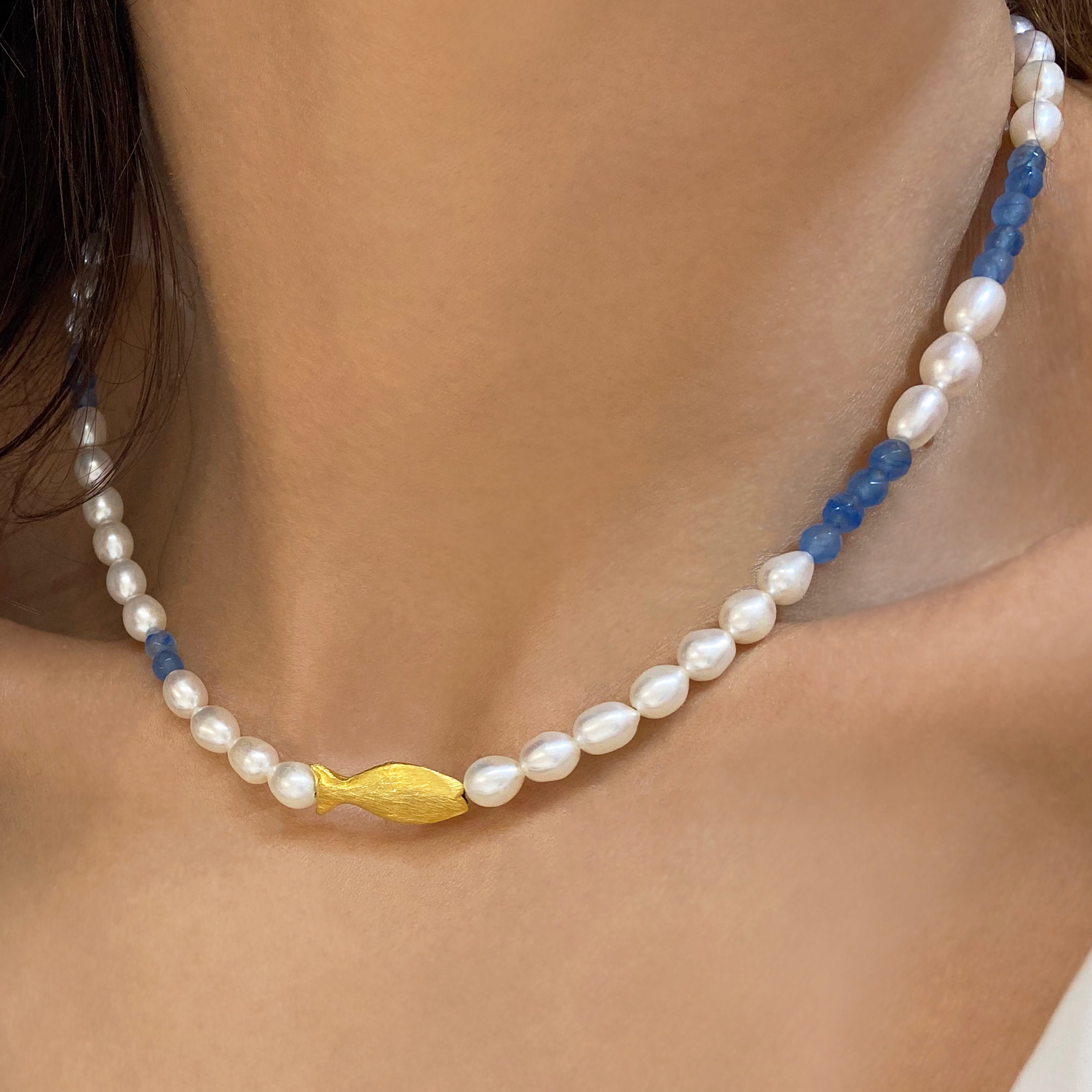 Seed Pearl Necklace with a gold fish and blue sapphire gems