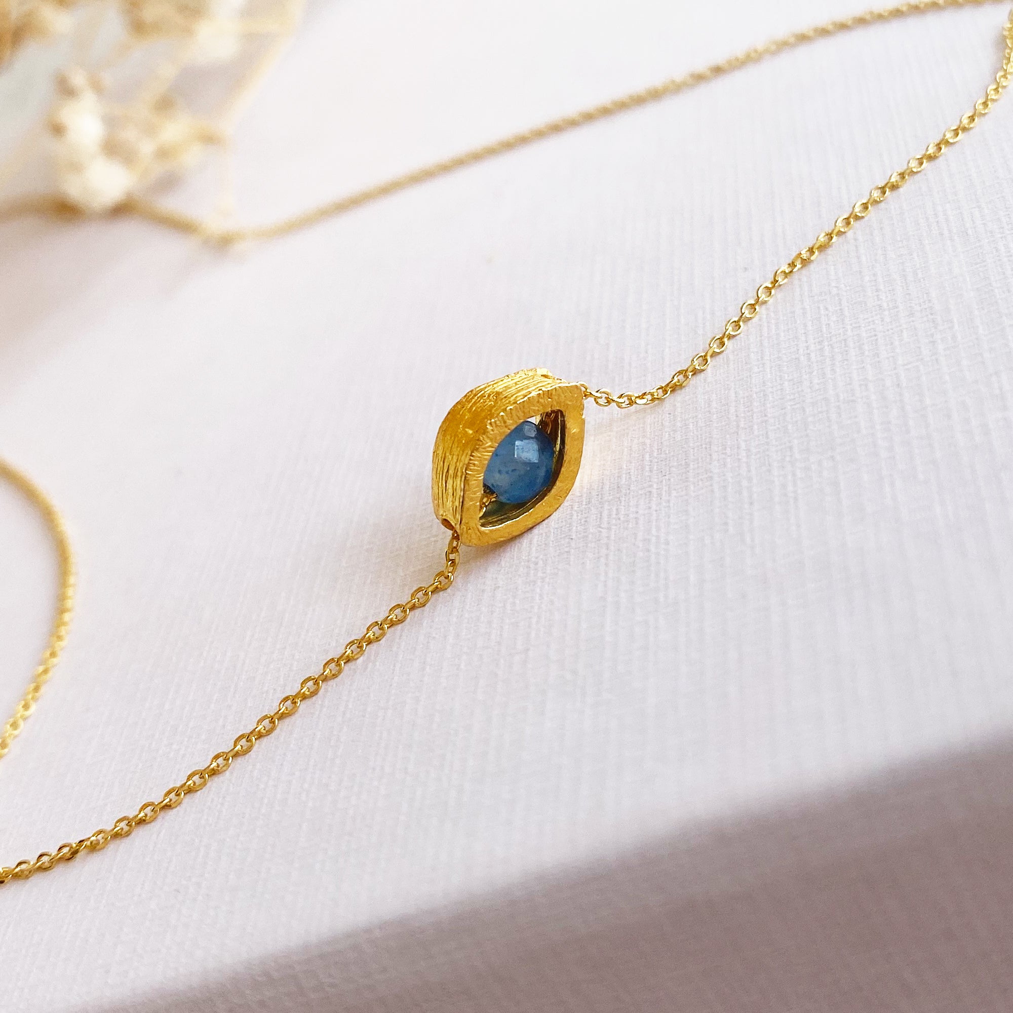 Evil Eye Necklace with a blue sapphire gemstone. Silver 925